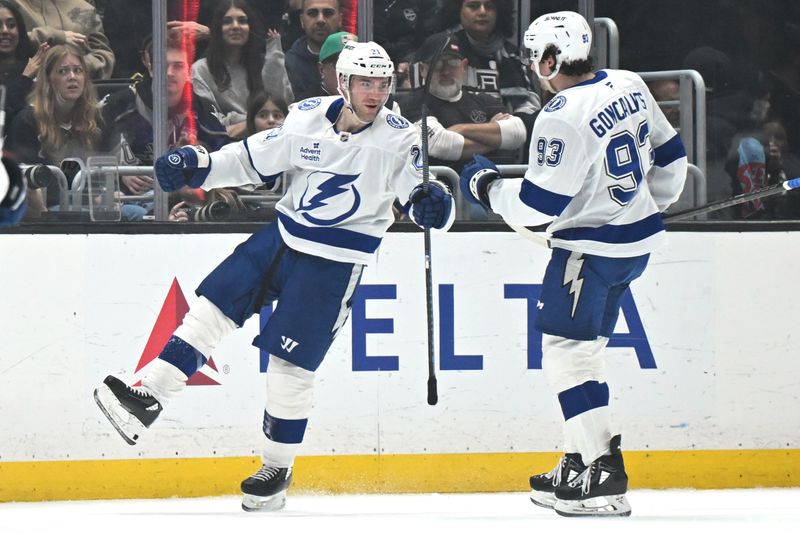 Jan 1, 2026; Los Angeles, California, USA; Tampa Bay Lightning center Brayden Point (21) and Tampa Bay Lightning center Gage Goncalves (93) celebrate a goal during the second period against the Los Angeles Kings at Crypto.com Arena. Mandatory Credit: Griffin Hooper-Imagn Images