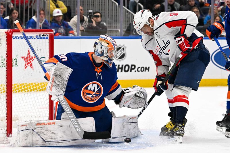 Dec 29, 2023; Elmont, New York, USA; Washington Capitals left wing Alex Ovechkin (8) attempts to put in a rebound on New York Islanders goaltender Ilya Sorokin (30) during the third period at UBS Arena. Mandatory Credit: Dennis Schneidler-USA TODAY Sports