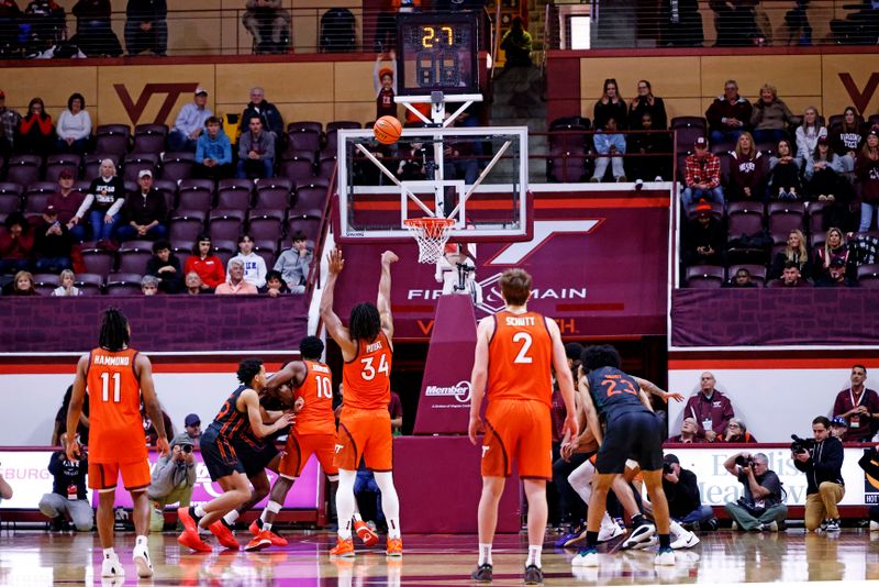 Jan 4, 2025; Blacksburg, Virginia, USA; Virginia Tech Hokies forward Mylyjael Poteat (34) shoots a free throw with 2.7 seconds left to win the game over the Miami Hurricanes at Cassell Coliseum. Mandatory Credit: Peter Casey-Imagn Images