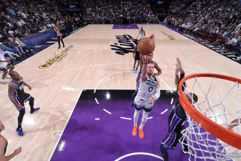 SACRAMENTO, CA - OCTOBER 24: Donte DiVincenzo #0 of the Minnesota Timberwolves drives to the basket during the game against the Sacramento Kings on October 24, 2024 at Golden 1 Center in Sacramento, California. NOTE TO USER: User expressly acknowledges and agrees that, by downloading and or using this Photograph, user is consenting to the terms and conditions of the Getty Images License Agreement. Mandatory Copyright Notice: Copyright 2024 NBAE (Photo by Rocky Widner/NBAE via Getty Images)