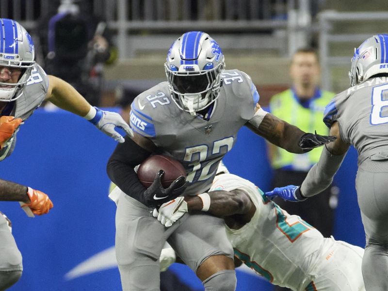 Detroit Lions running back D'Andre Swift (32) rushes against the Miami Dolphins during an NFL football game, Sunday, Oct. 30, 2022, in Detroit. (AP Photo/Rick Osentoski)