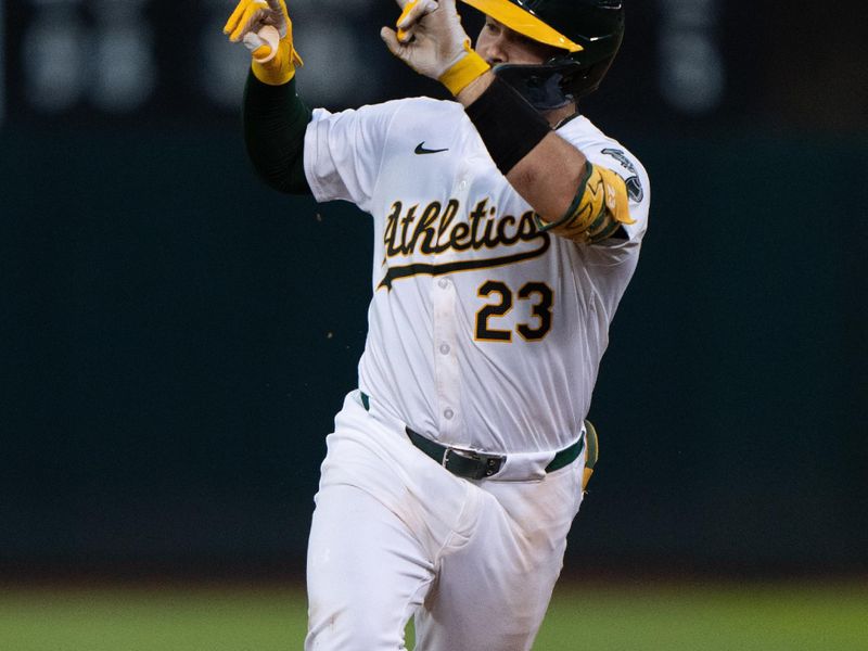 Jul 5, 2024; Oakland, California, USA;  Oakland Athletics catcher Shea Langeliers (23) celebrates after hitting a solo home run during the seventh inning against the Baltimore Orioles at Oakland-Alameda County Coliseum. Mandatory Credit: Stan Szeto-USA TODAY Sports
