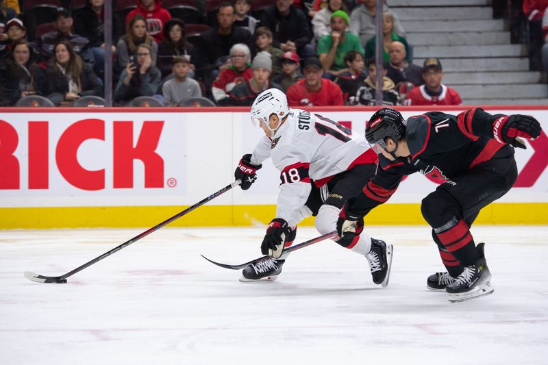 Mar 17, 2024; Ottawa, Ontario, CAN; Ottawa Senators center Tim Stutzle (18) controls the puck in front of Carolina Hurricanes defenseman Brady Skjei (76) in the first period at the Canadian Tire Centre. Mandatory Credit: Marc DesRosiers-USA TODAY Sports