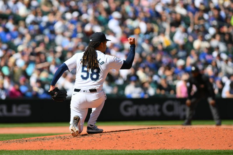 Apr 14, 2024; Seattle, Washington, USA; Seattle Mariners starting pitcher Luis Castillo (58) celebrates a strikeout against the Chicago Cubs during the sixth inning at T-Mobile Park. Mandatory Credit: Steven Bisig-USA TODAY Sports