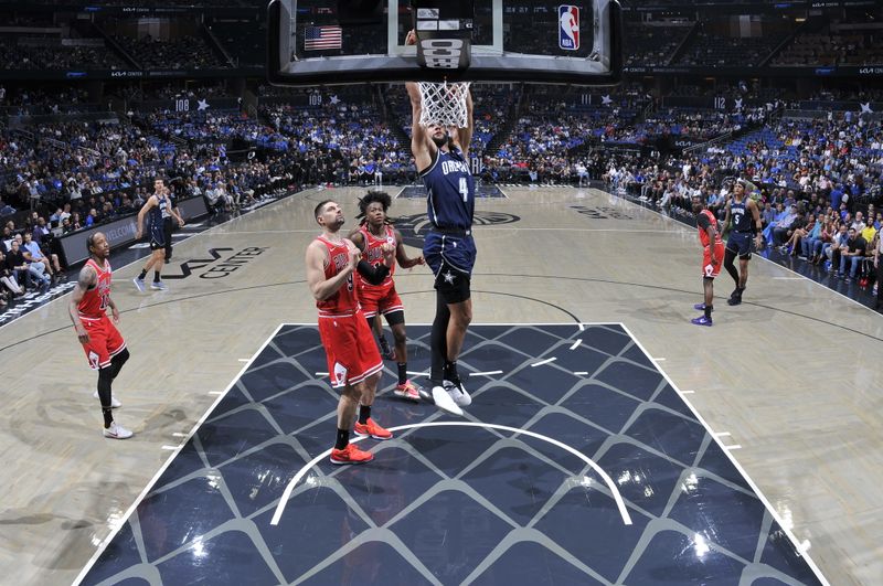 ORLANDO, FL - APRIL 7: Jalen Suggs #4 of the Orlando Magic dunks the ball during the game against the Chicago Bulls on April 7, 2024 at the Kia Center in Orlando, Florida. NOTE TO USER: User expressly acknowledges and agrees that, by downloading and or using this photograph, User is consenting to the terms and conditions of the Getty Images License Agreement. Mandatory Copyright Notice: Copyright 2024 NBAE (Photo by Fernando Medina/NBAE via Getty Images)