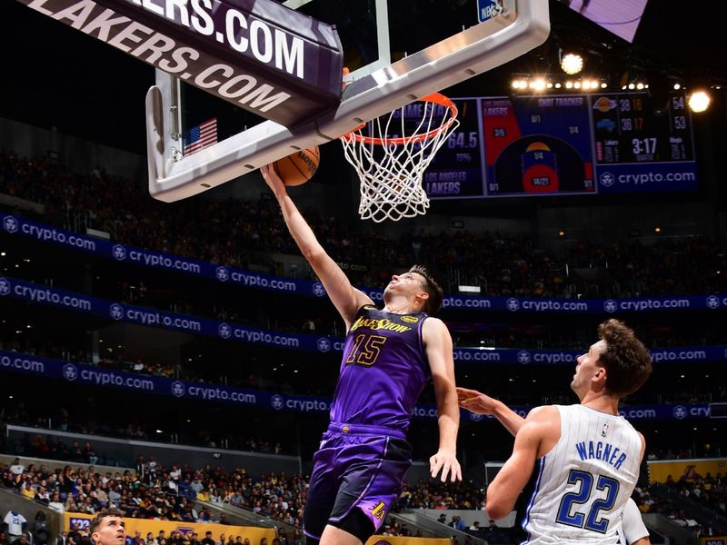 LOS ANGELES, CA - NOVEMBER 21: Austin Reaves #15 of the Los Angeles Lakers drives to the basket during the game against the Orlando Magic on November 21, 2024 at Crypto.Com Arena in Los Angeles, California. NOTE TO USER: User expressly acknowledges and agrees that, by downloading and/or using this Photograph, user is consenting to the terms and conditions of the Getty Images License Agreement. Mandatory Copyright Notice: Copyright 2024 NBAE (Photo by Adam Pantozzi/NBAE via Getty Images)