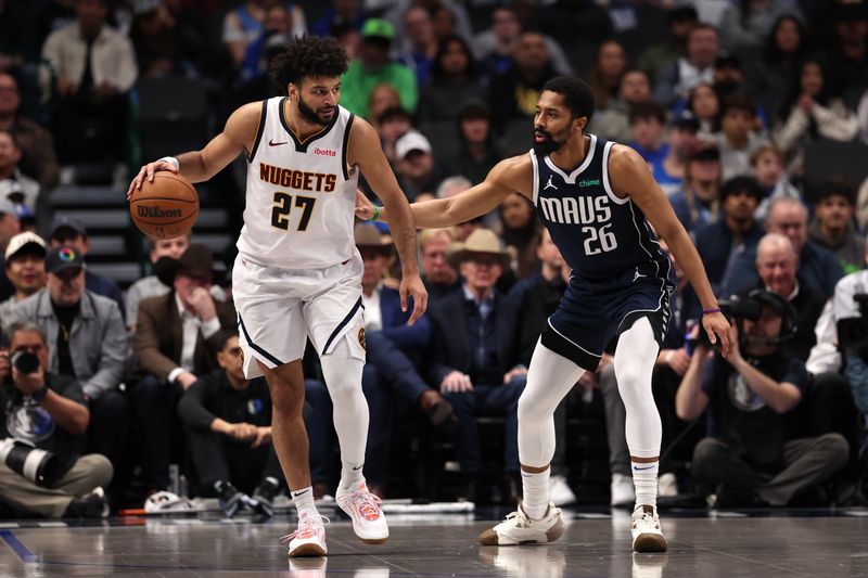 DALLAS, TEXAS - JANUARY 14: Jamal Murray #27 of the Denver Nuggets controls the ball against Spencer Dinwiddie #26 of the Dallas Mavericks during the third quarter at American Airlines Center on January 14, 2025 in Dallas, Texas. NOTE TO USER: User expressly acknowledges and agrees that, by downloading and/or using this photograph, user is consenting to the terms and conditions of the Getty Images License Agreement. (Photo by Sam Hodde/Getty Images)