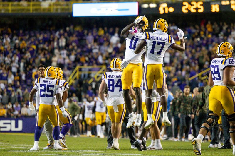 Nov 11, 2023; Baton Rouge, Louisiana, USA;  LSU Tigers wide receiver Chris Hilton Jr. (17) and wide receiver Chris Hilton Jr. (17) react to a touchdown in the final minute against the Florida Gators during the second half at Tiger Stadium. Mandatory Credit: Stephen Lew-USA TODAY Sports