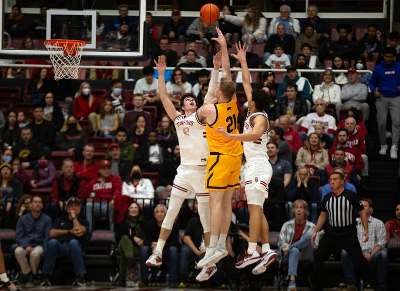 Jan 28, 2023; Stanford, California, USA; Stanford Cardinal forward Maxime Raynaud (42) defends a shot by California Golden Bears forward Lars Thiemann (21) during the first half at Maples Pavilion. Mandatory Credit: D. Ross Cameron-USA TODAY Sports