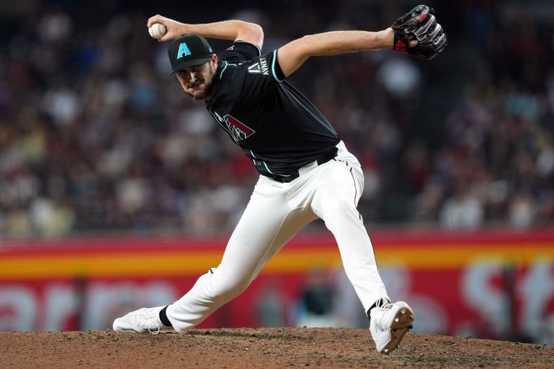 Jun 16, 2024; Phoenix, Arizona, USA; Arizona Diamondbacks pitcher Ryan Thompson (81) pitches against the Chicago White Sox during the eighth inning at Chase Field. Mandatory Credit: Joe Camporeale-USA TODAY Sports