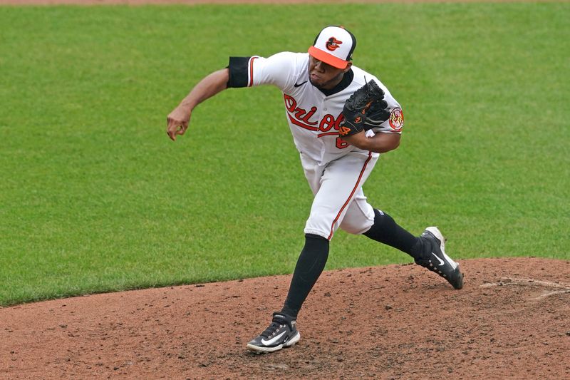 Jul 16, 2023; Baltimore, Maryland, USA; Baltimore Orioles pitcher Eduard Bazardo (67) delivers in the ninth inning against the Miami Marlins at Oriole Park at Camden Yards. Mandatory Credit: Mitch Stringer-USA TODAY Sports