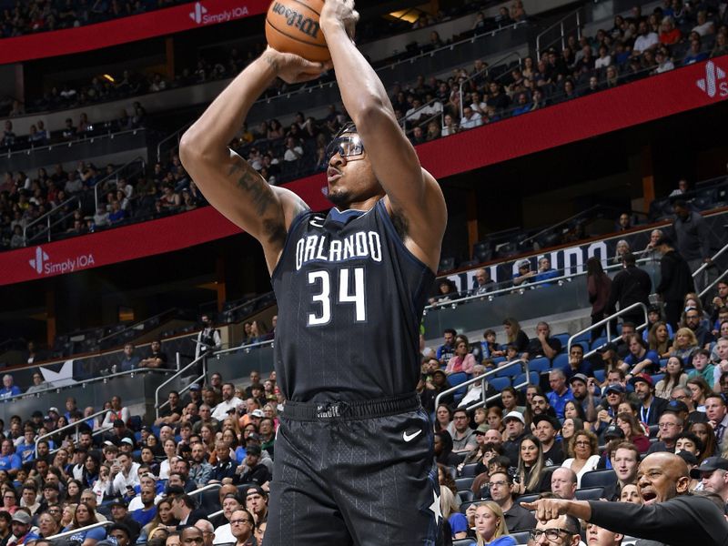 ORLANDO, FL - JANUARY 4: Wendell Carter Jr. #34 of the Orlando Magic shoots a three point basket against the Oklahoma City Thunder on January 4, 2023 at Amway Center in Orlando, Florida. NOTE TO USER: User expressly acknowledges and agrees that, by downloading and or using this photograph, User is consenting to the terms and conditions of the Getty Images License Agreement. Mandatory Copyright Notice: Copyright 2023 NBAE (Photo by Fernando Medina/NBAE via Getty Images)