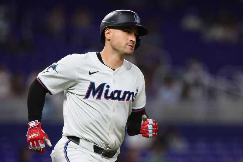 Aug 19, 2024; Miami, Florida, USA; Miami Marlins catcher Nick Fortes (4) circles the bases after hitting a solo home run against the Arizona Diamondbacks during the third inning at loanDepot Park. Mandatory Credit: Sam Navarro-USA TODAY Sports