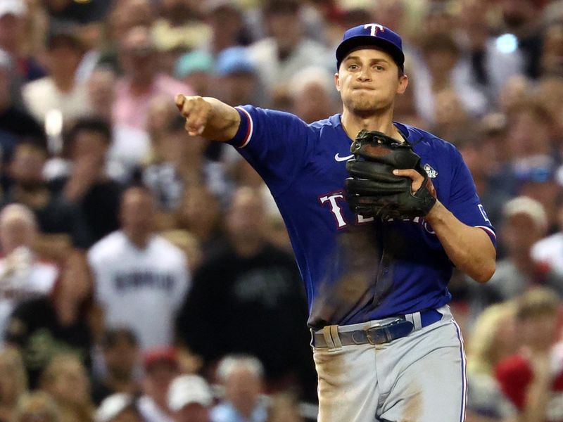 Nov 1, 2023; Phoenix, Arizona, USA; Texas Rangers shortstop Corey Seager (5) makes a throw to first base for the out against the Arizona Diamondbacks during the eighth inning in game five of the 2023 World Series at Chase Field. Mandatory Credit: Mark J. Rebilas-USA TODAY Sports