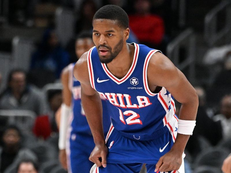 ATLANTA, GEORGIA - MARCH 10: Jared Butler #12 of the Philadelphia 76ers looks on during the game against the Atlanta Hawks during the first quarter at State Farm Arena on March 10, 2025 in Atlanta, Georgia. NOTE TO USER: User expressly acknowledges and agrees that, by downloading and or using this photograph, User is consenting to the terms and conditions of the Getty Images License Agreement.  (Photo by Paras Griffin/Getty Images)
