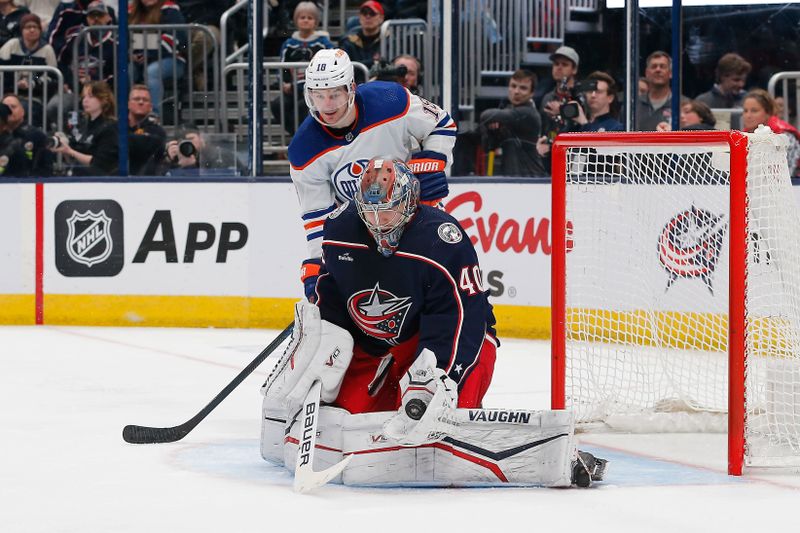 Mar 7, 2024; Columbus, Ohio, USA; Columbus Blue Jackets goalie Daniil Tarasov (40) makes a glove save as Edmonton Oilers center Zach Hyman (18) looks for a rebound during the third period at Nationwide Arena. Mandatory Credit: Russell LaBounty-USA TODAY Sports