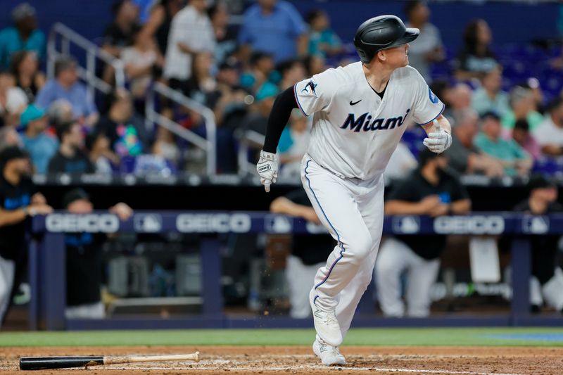 Jun 4, 2023; Miami, Florida, USA; Miami Marlins designated hitter Garrett Cooper (26) looks on after hitting a three-run home run against the Oakland Athletics during the fifth inning at loanDepot Park. Mandatory Credit: Sam Navarro-USA TODAY Sports