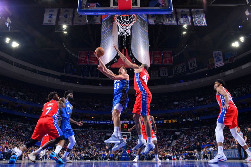 PHILADELPHIA, PA - APRIL 12: Franz Wagner #22 of the Orlando Magic drives to the basket during the game against the Philadelphia 76ers on April 12, 2024 at the Wells Fargo Center in Philadelphia, Pennsylvania NOTE TO USER: User expressly acknowledges and agrees that, by downloading and/or using this Photograph, user is consenting to the terms and conditions of the Getty Images License Agreement. Mandatory Copyright Notice: Copyright 2024 NBAE (Photo by Jesse D. Garrabrant/NBAE via Getty Images)