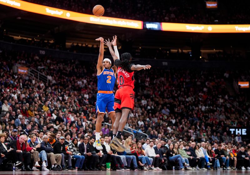 TORONTO, ON - MARCH 27: Miles McBride #2 of the New York Knicks shoots against Donte DiVincenzo #0 of the New York Knicks during the first half of their basketball game at the Scotiabank Arena on March 27, 2024 in Toronto, Ontario, Canada. NOTE TO USER: User expressly acknowledges and agrees that, by downloading and/or using this Photograph, user is consenting to the terms and conditions of the Getty Images License Agreement. (Photo by Mark Blinch/Getty Images)