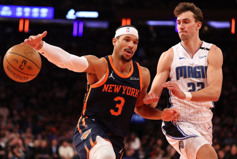 NEW YORK, NEW YORK - DECEMBER 03: Josh Hart #3 of the New York Knicks dribbles against Franz Wagner #22 of the Orlando Magic during their game at Madison Square Garden on December 03, 2024 in New York City.   User expressly acknowledges and agrees that, by downloading and or using this photograph, User is consenting to the terms and conditions of the Getty Images License Agreement.  (Photo by Al Bello/Getty Images)