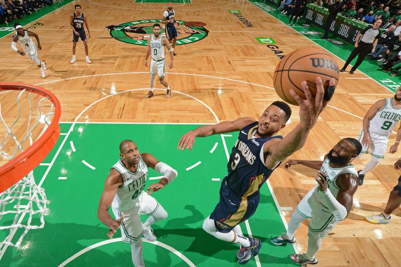 BOSTON, MA - JANUARY 29: CJ McCollum #3 of the New Orleans Pelicans drives to the basket during the game against the Boston Celtics on January 29, 2024 at the TD Garden in Boston, Massachusetts. NOTE TO USER: User expressly acknowledges and agrees that, by downloading and or using this photograph, User is consenting to the terms and conditions of the Getty Images License Agreement. Mandatory Copyright Notice: Copyright 2024 NBAE  (Photo by Brian Babineau/NBAE via Getty Images)