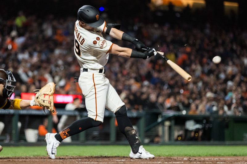 Sep 27, 2023; San Francisco, California, USA;  San Francisco Giants center fielder Tyler Fitzgerald (49) hits and RBI single against the San Diego Padres during the fifth inning at Oracle Park. Mandatory Credit: John Hefti-USA TODAY Sports