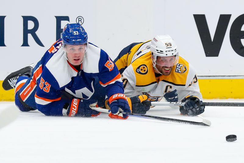 Apr 6, 2024; Elmont, New York, USA; New York Islanders center Casey Cizikas (53) and Nashville Predators defenseman Roman Josi (59) battle for the puck during the third period at UBS Arena. Mandatory Credit: Tom Horak-USA TODAY Sports