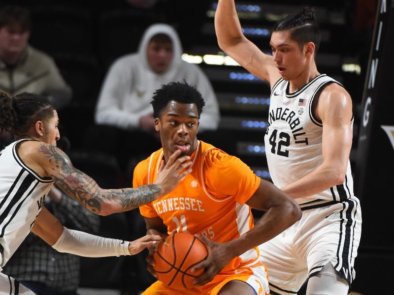 Feb 8, 2023; Nashville, Tennessee, USA; Tennessee Volunteers forward Tobe Awaka (11) works against Vanderbilt Commodores forward Myles Stute (10) and forward Quentin Millora-Brown (42) during the first half at Memorial Gymnasium. Mandatory Credit: Christopher Hanewinckel-USA TODAY Sports