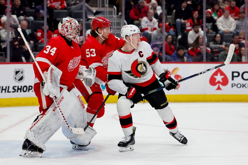 Jan 31, 2024; Detroit, Michigan, USA;  Detroit Red Wings defenseman Moritz Seider (53) and Ottawa Senators left wing Brady Tkachuk (7) fight for position in front of goaltender Alex Lyon (34) in the first period at Little Caesars Arena. Mandatory Credit: Rick Osentoski-USA TODAY Sports