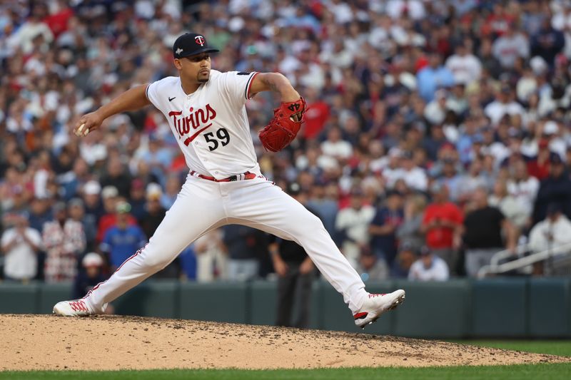 Oct 4, 2023; Minneapolis, Minnesota, USA; Minnesota Twins relief pitcher Jhoan Duran (59) delivers a pitch in the ninth inning against the Toronto Blue Jays during game two of the Wildcard series for the 2023 MLB playoffs at Target Field. Mandatory Credit: Jesse Johnson-USA TODAY Sports