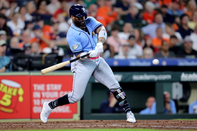 Jul 30, 2023; Houston, Texas, USA; Tampa Bay Rays first baseman Yandy Diaz (2) hits an RBI single against the Houston Astros during the fourth inning at Minute Maid Park. Mandatory Credit: Erik Williams-USA TODAY Sports