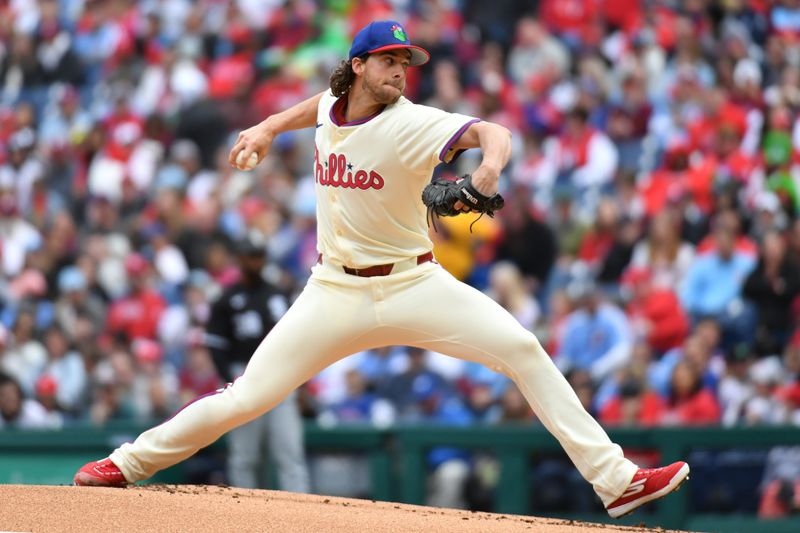 Apr 21, 2024; Philadelphia, Pennsylvania, USA; Philadelphia Phillies pitcher Aaron Nola (27) throws a pitch against the Chicago White Sox during the first inning at Citizens Bank Park. Mandatory Credit: Eric Hartline-USA TODAY Sports