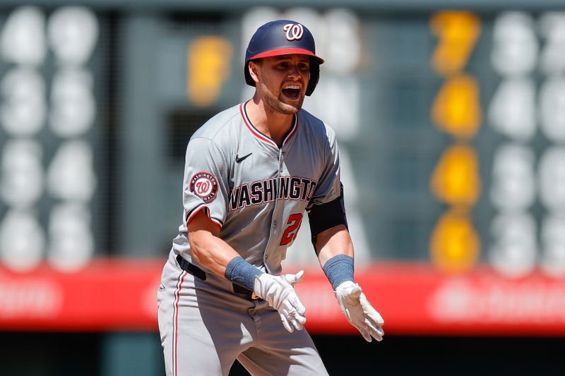 Jun 23, 2024; Denver, Colorado, USA; Washington Nationals right fielder Lane Thomas (28) reacts from second on an RBI double in the ninth inning against the Colorado Rockies at Coors Field. Mandatory Credit: Isaiah J. Downing-USA TODAY Sports