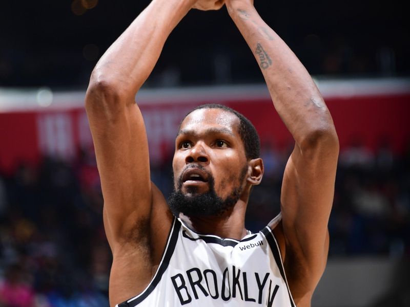 LOS ANGELES, CA - NOVEMBER 12: Kevin Durant #7 of the Brooklyn Nets shoots a free throw during the game against the LA Clippers on November 12, 2022 at Crypto.com Arena in Los Angeles, California. NOTE TO USER: User expressly acknowledges and agrees that, by downloading and/or using this Photograph, user is consenting to the terms and conditions of the Getty Images License Agreement. Mandatory Copyright Notice: Copyright 2022 NBAE (Photo by Adam Pantozzi/NBAE via Getty Images)