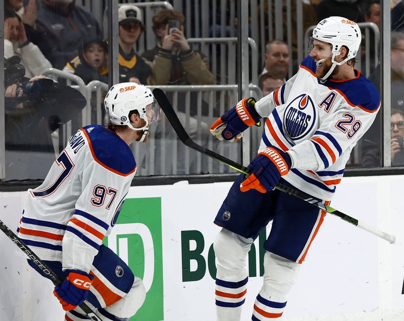 Mar 5, 2024; Boston, Massachusetts, USA; Edmonton Oilers center Leon Draisaitl (29) celebrates his game winning overtime goal with teammate center Connor McDavid (97) against the Boston Bruins at TD Garden. Mandatory Credit: Winslow Townson-USA TODAY Sports
