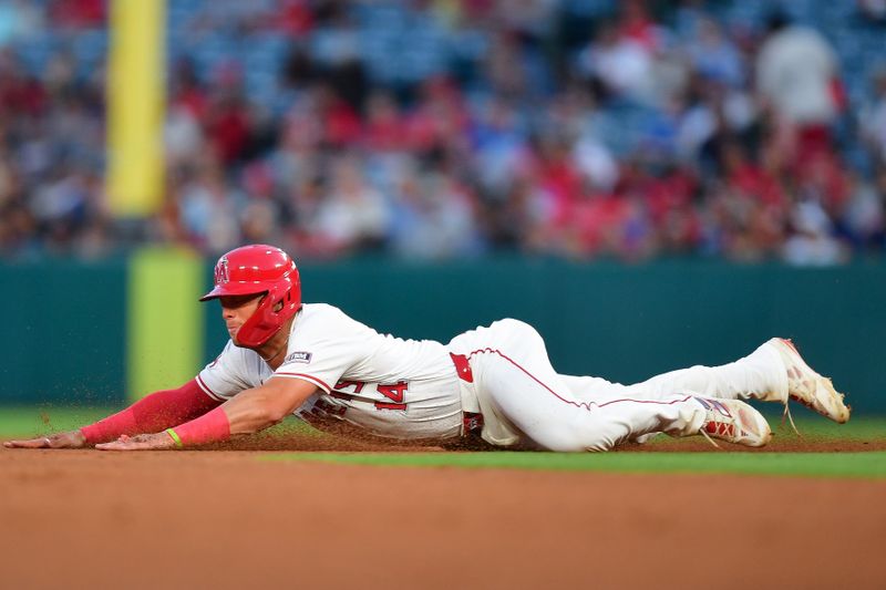 Jun 27, 2024; Anaheim, California, USA; Los Angeles Angels catcher Logan O'Hoppe (14) reaches second on a wild pitch by Detroit Tigers starting pitcher Jack Flaherty (9) during the sixth inning at Angel Stadium. Mandatory Credit: Gary A. Vasquez-USA TODAY Sports