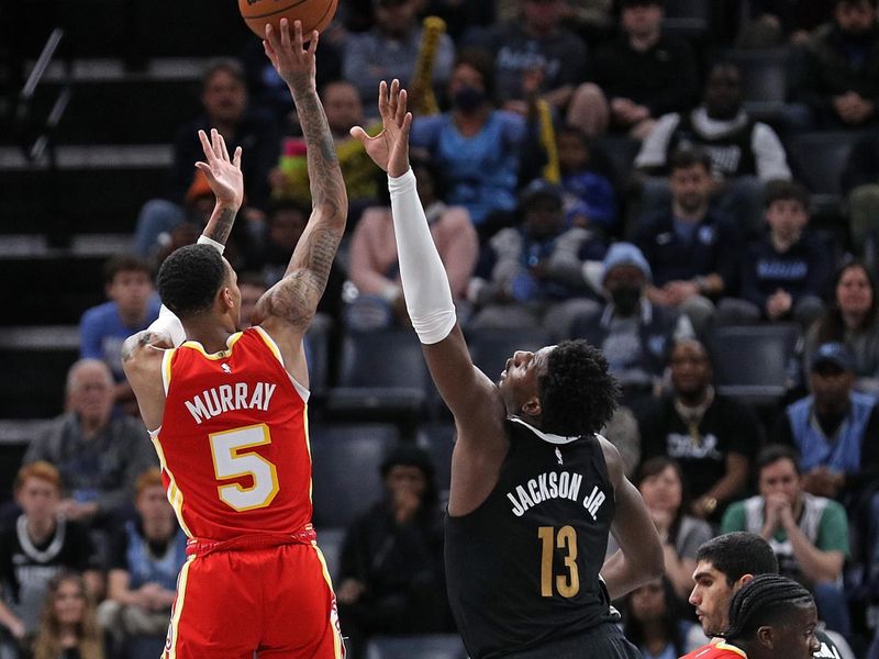 MEMPHIS, TENNESSEE - MARCH 08: Dejounte Murray #5 of the Atlanta Hawks shoots against Jaren Jackson Jr. #13 of the Memphis Grizzlies during the second half at FedExForum on March 08, 2024 in Memphis, Tennessee. NOTE TO USER: User expressly acknowledges and agrees that, by downloading and or using this photograph, User is consenting to the terms and conditions of the Getty Images License Agreement. (Photo by Justin Ford/Getty Images)