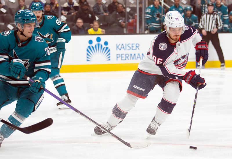 Mar 14, 2023; San Jose, California, USA; Columbus Blue Jackets center Jack Roslovic (96) controls the puck in front of San Jose Sharks left winger William Eklund (72) during the first period at SAP Center at San Jose. Mandatory Credit: D. Ross Cameron-USA TODAY Sports