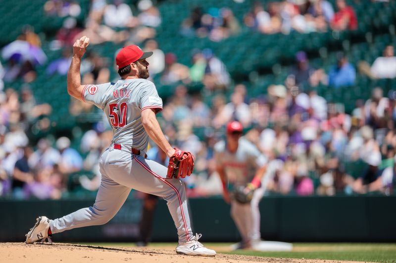 Jun 5, 2024; Denver, Colorado, USA; Cincinnati Reds relief pitcher Sam Moll (50) delivers a pitch during the fourth inning against the Colorado Rockies at Coors Field. Mandatory Credit: Andrew Wevers-USA TODAY Sports