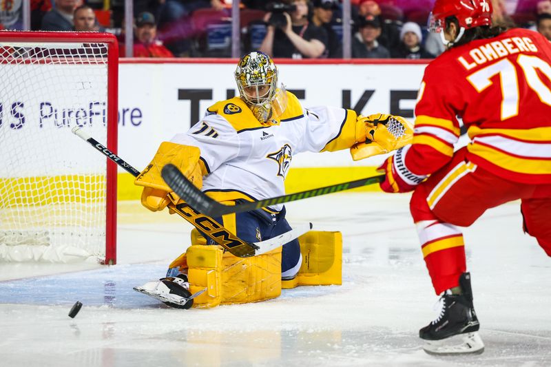 Nov 15, 2024; Calgary, Alberta, CAN; Nashville Predators goaltender Juuse Saros (74) makes a save against Calgary Flames left wing Ryan Lomberg (70) during the second period at Scotiabank Saddledome. Mandatory Credit: Sergei Belski-Imagn Images