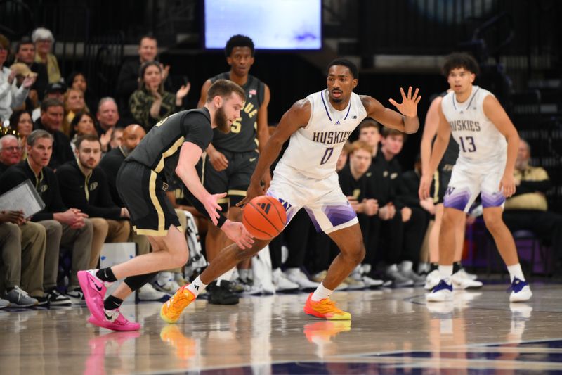 Jan 15, 2025; Seattle, Washington, USA; Washington Huskies guard Mekhi Mason (0) guards Purdue Boilermakers guard Braden Smith (3) during the second half at Alaska Airlines Arena at Hec Edmundson Pavilion. Mandatory Credit: Steven Bisig-Imagn Images