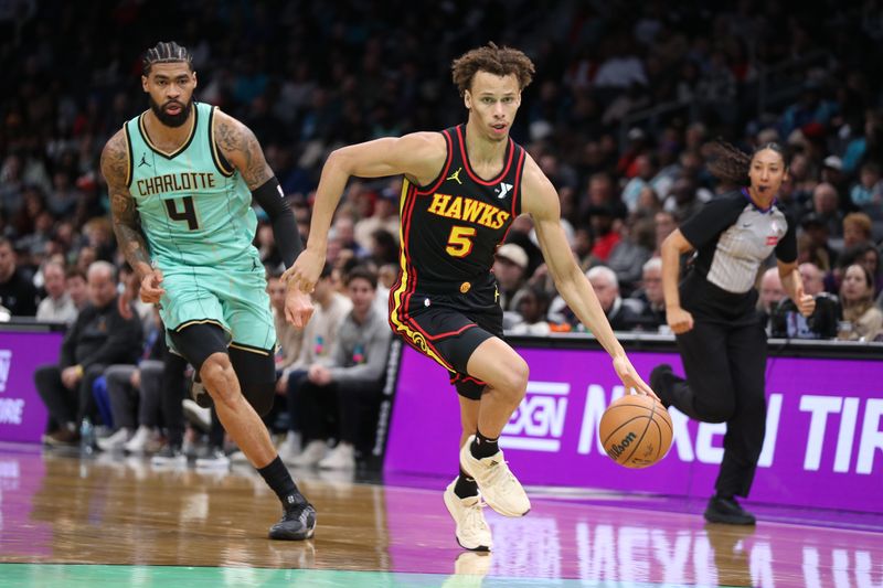 CHARLOTTE, NC - NOVEMBER 30: Dyson Daniels #5 of the Atlanta Hawks drives to the basket during the game against the Charlotte Hornets on November 30, 2024 at Spectrum Center in Charlotte, North Carolina. NOTE TO USER: User expressly acknowledges and agrees that, by downloading and or using this photograph, User is consenting to the terms and conditions of the Getty Images License Agreement. Mandatory Copyright Notice: Copyright 2024 NBAE (Photo by Brock Williams-Smith/NBAE via Getty Images)