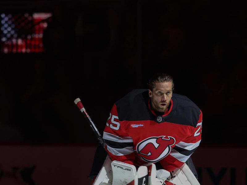 Jan 29, 2026; Newark, New Jersey, USA; New Jersey Devils goaltender Jacob Markstrom (25) during the National Anthem before the start of their game against the Nashville Predators at Prudential Center. Mandatory Credit: Ed Mulholland-Imagn Images