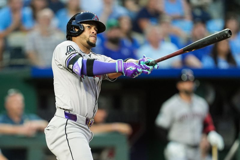 Jul 23, 2024; Kansas City, Missouri, USA; Arizona Diamondbacks second baseman Ketel Marte (4) watches a home run during the fifth inning against the Kansas City Royals at Kauffman Stadium. Mandatory Credit: Jay Biggerstaff-USA TODAY Sports