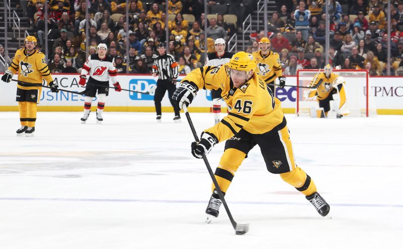 Feb 26, 2026; Pittsburgh, Pennsylvania, USA;  Pittsburgh Penguins center Blake Lizotte (46) shoots to score an empty net goal against the New Jersey Devils during the third period at PPG Paints Arena. Mandatory Credit: Charles LeClaire-Imagn Images