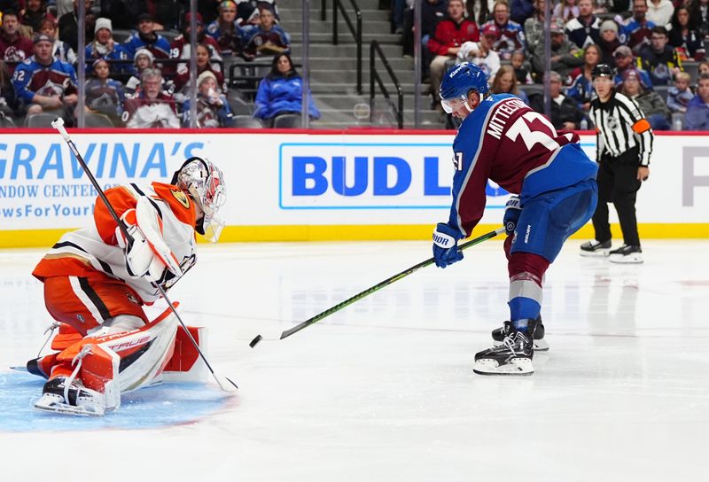 Oct 18, 2024; Denver, Colorado, USA; Colorado Avalanche center Casey Mittelstadt (37) shoots and scores on Anaheim Ducks goaltender Lukas Dostal (1) in the second period at Ball Arena. Mandatory Credit: Ron Chenoy-Imagn Images