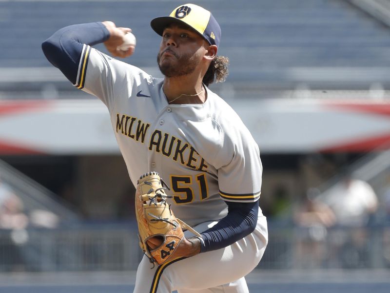 Sep 6, 2023; Pittsburgh, Pennsylvania, USA;  Milwaukee Brewers starting pitcher Freddy Peralta (51) delivers a pitch against the Pittsburgh Pirates during the first inning at PNC Park. Mandatory Credit: Charles LeClaire-USA TODAY Sports