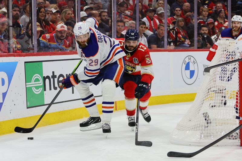 Jun 24, 2024; Sunrise, Florida, USA; Edmonton Oilers forward Leon Draisaitl (29) controls the puck against Florida Panthers forward Sam Reinhart (13) during the third period in game seven of the 2024 Stanley Cup Final at Amerant Bank Arena. Mandatory Credit: Sam Navarro-USA TODAY Sports