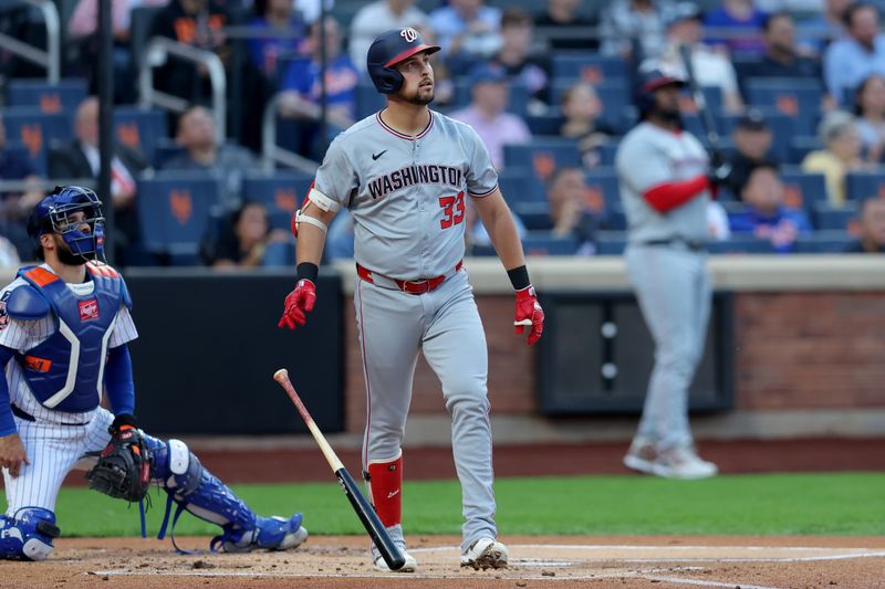 Jun 10, 2025; New York City, New York, USA; Washington Nationals first baseman Nathaniel Lowe (33) watches his two run home run against the New York Mets during the first inning at Citi Field. Mandatory Credit: Brad Penner-Imagn Images