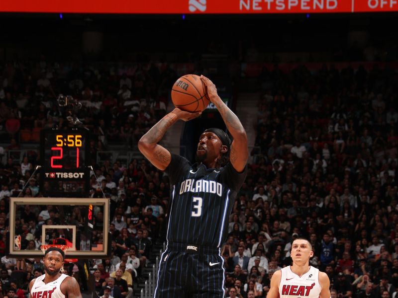 MIAMI, FL - OCTOBER 23: Kentavious Caldwell-Pope #3 of the Orlando Magic shoots a three point basket during the game against the Miami Heat on October 23, 2024 at Kaseya Center in Miami, Florida. NOTE TO USER: User expressly acknowledges and agrees that, by downloading and or using this Photograph, user is consenting to the terms and conditions of the Getty Images License Agreement. Mandatory Copyright Notice: Copyright 2024 NBAE (Photo by Issac Baldizon/NBAE via Getty Images)